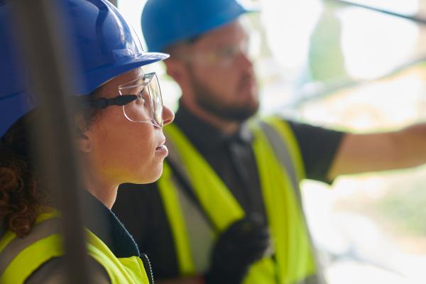 Building contractor chatting to architect